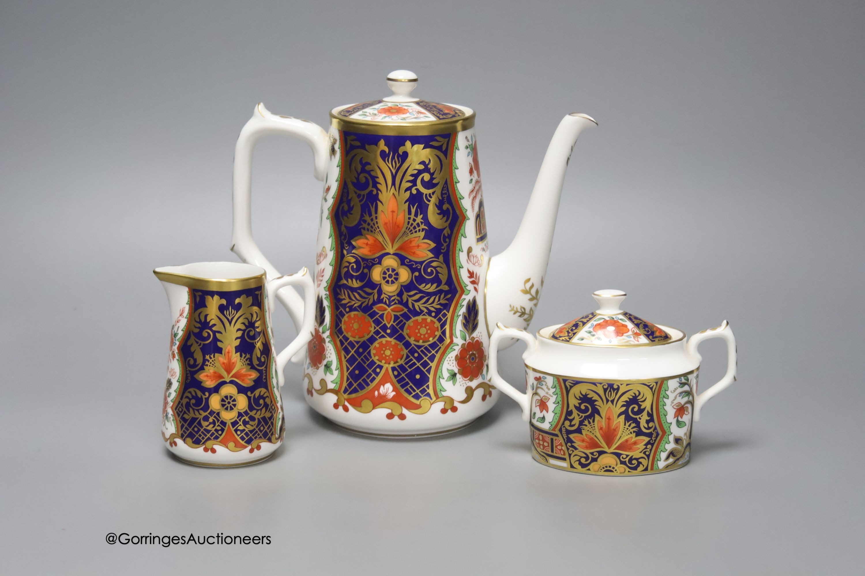 A Royal Crown Derby Rich Japan Pardoe pattern three piece coffee set, tallest 19cm